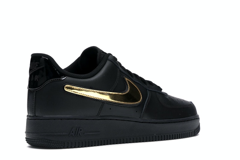 black nike shoes gold swoosh