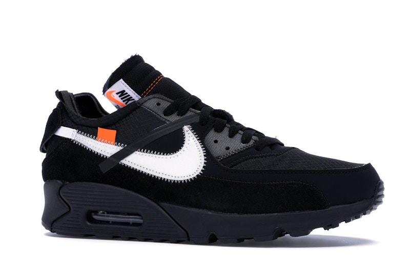 black nike shoes with gold swoosh