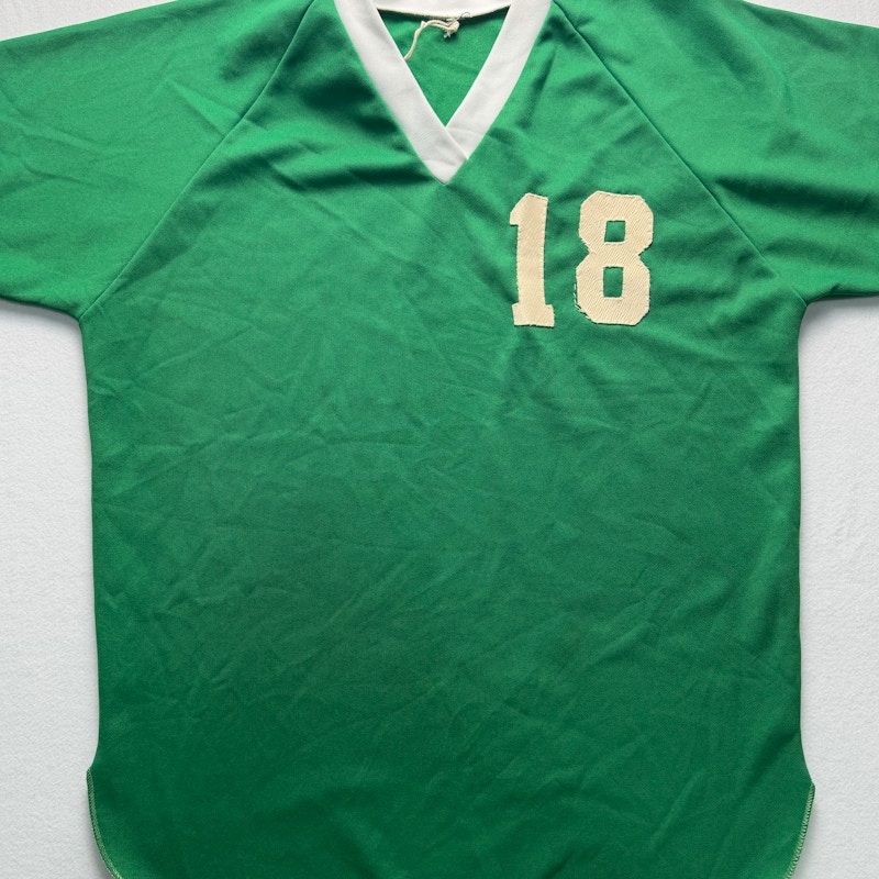 Green and White Jersey Number 18