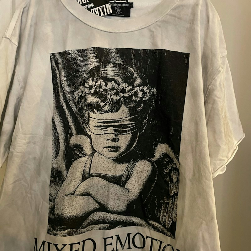 Mixed Emotion Blindfolded Angel Graphic T-Shirt White