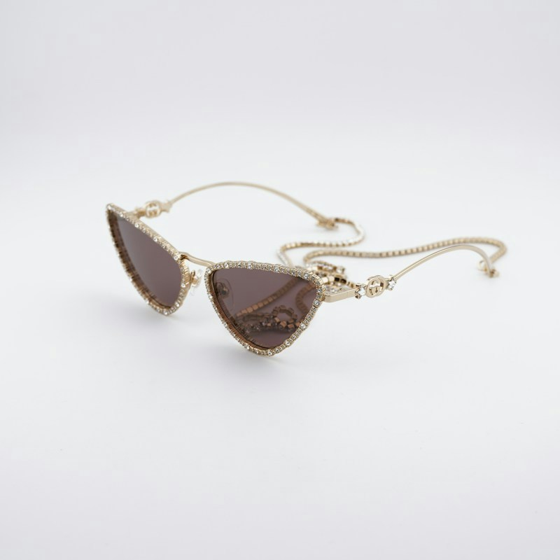 Gucci GG1569S 001 Cat Eye Sunglasses Gold with White Stone / Brown