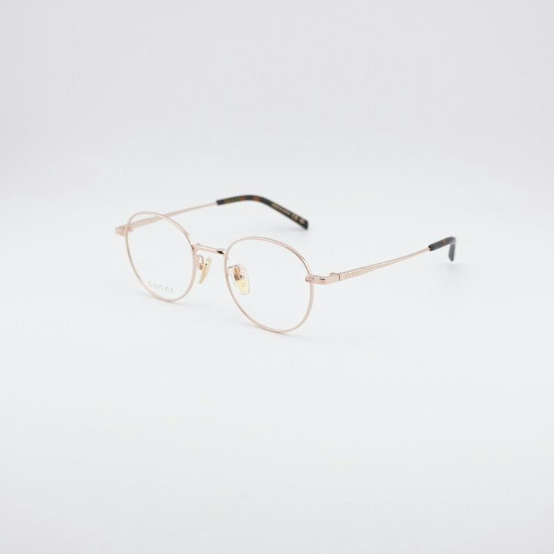 Occhiali da vista Gucci GG2004OA 001 rotondi in oro rosa lucido