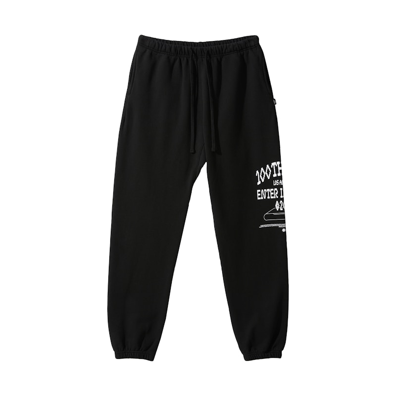 black joggers with white writing