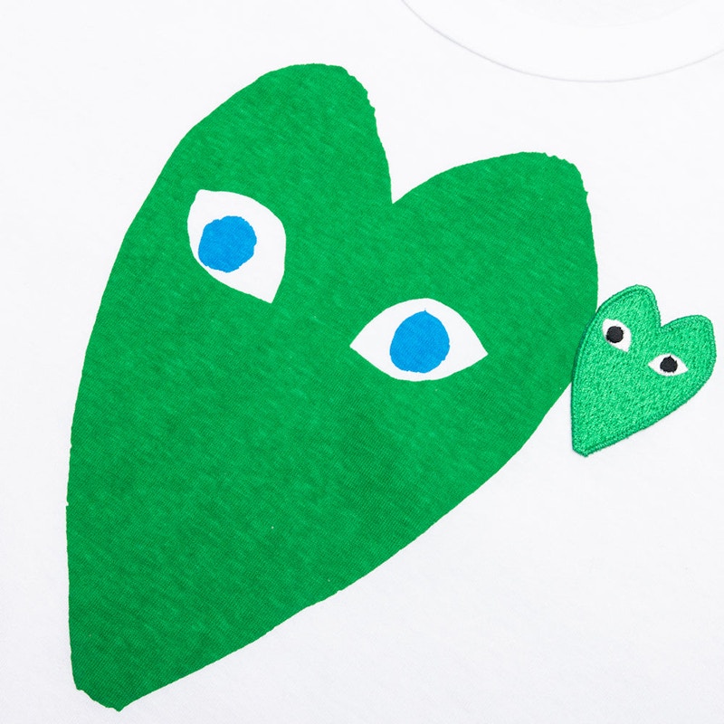 Green and white store comme des garcons