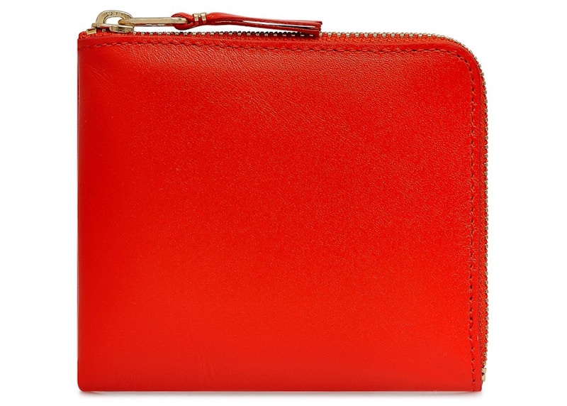 Comme des garcons discount zip wallet que significa