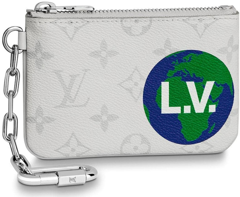 Woman with white Louis Vuitton bag with colorful logos on