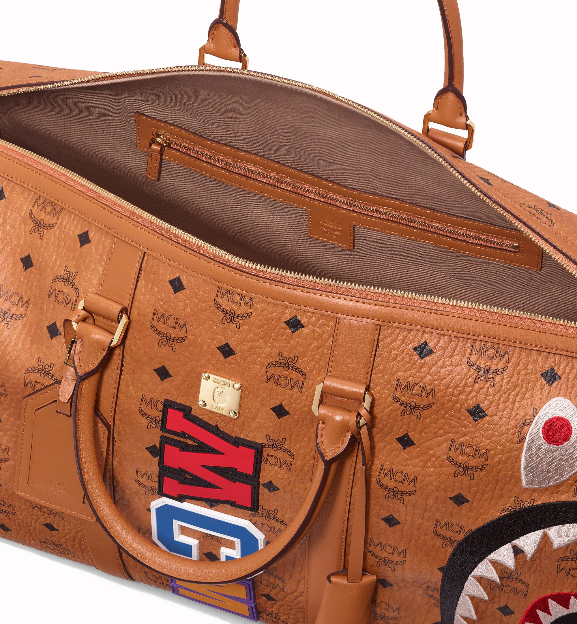 MCM x BAPE Shark Weekender Visetos Cognac in Coated Canvas with 24k Gold  Plated - GB