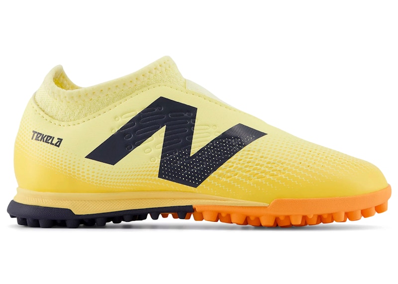 New Balance Tekela Magique V4+ TF Energy Rush Pack Sneakers in Parchment/Clementine/Hot Mango