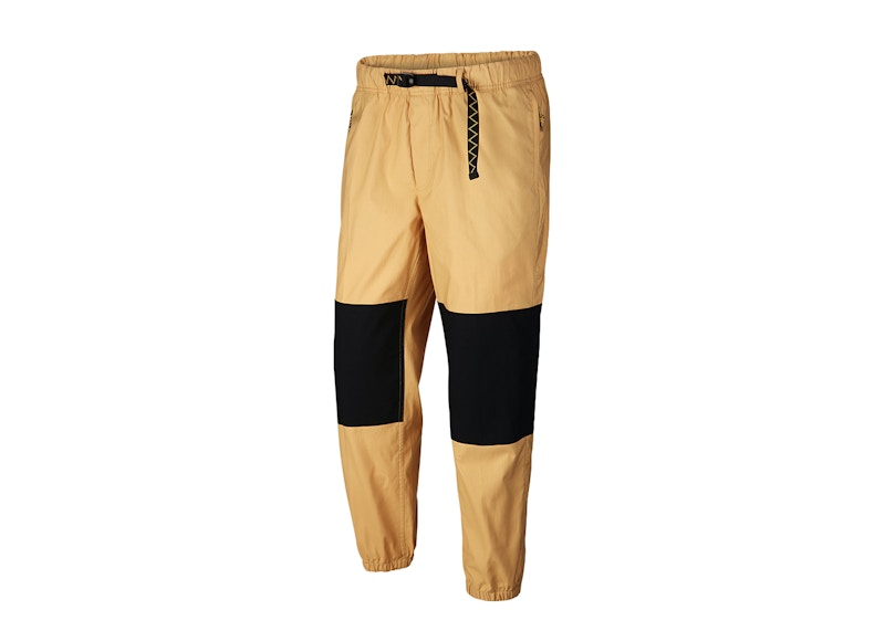 Nike black and gold hot sale pants