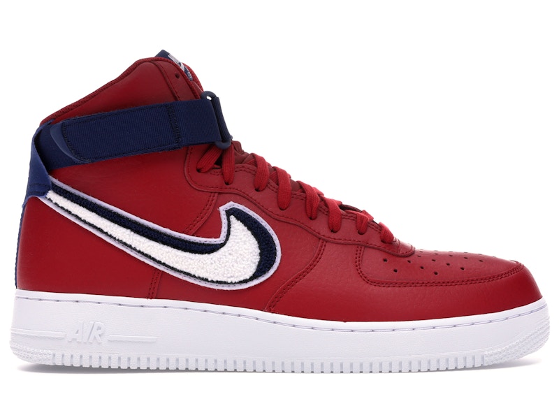 white nikes with red and blue swoosh