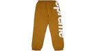 Supreme Pantalón Spellout Track Dark Dorado